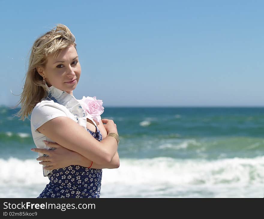 Young blonde woman vacationing at the beach. Young blonde woman vacationing at the beach