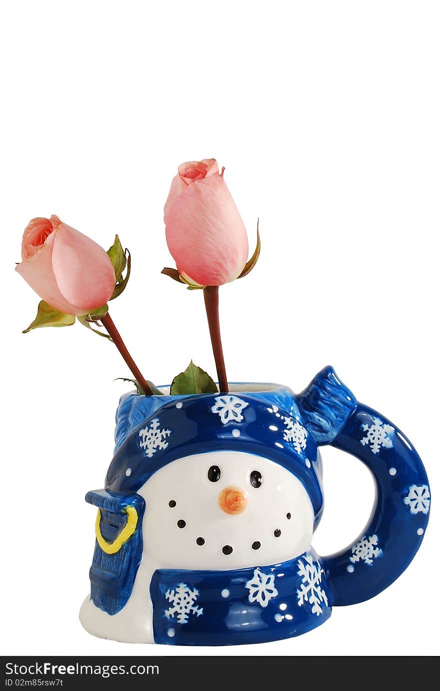 Two beautiful pink rose in lovely snowmen shape mug isolated on a white background. Two beautiful pink rose in lovely snowmen shape mug isolated on a white background.