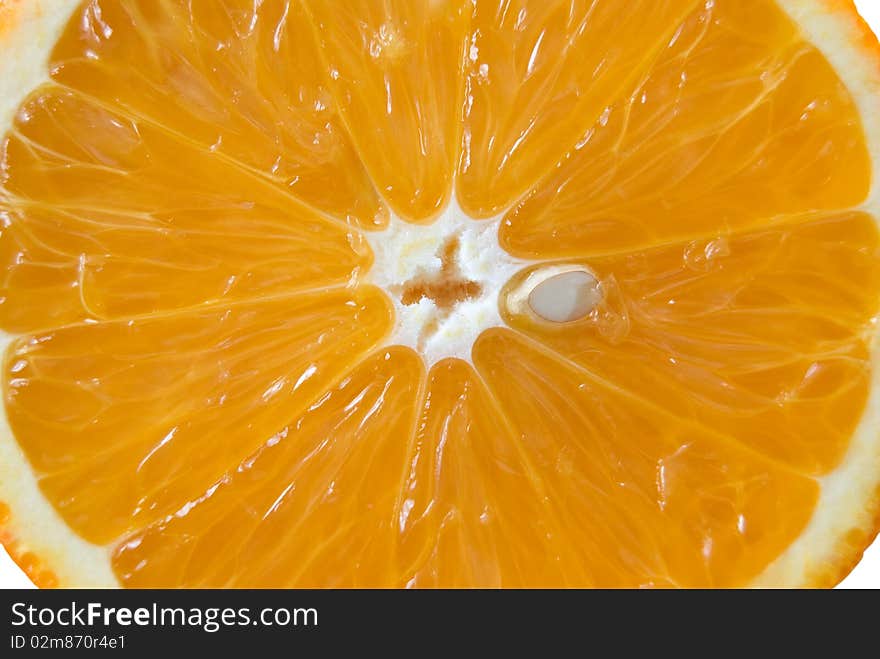 Orange slice with a stone, macro. Orange slice with a stone, macro