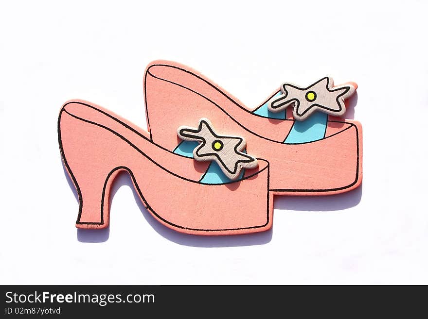 Miniature model of a pair of princess shoes. shoe shopping concept.