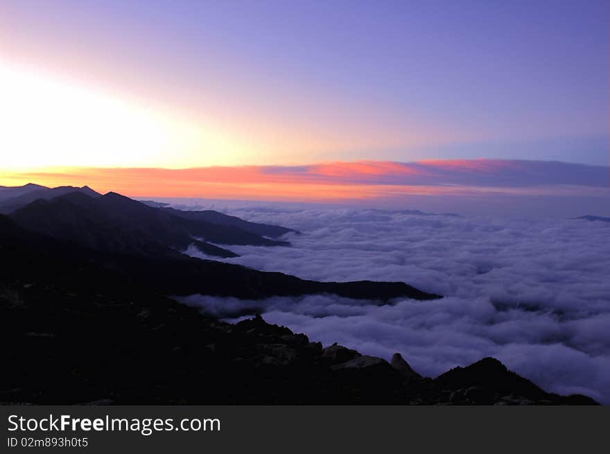 Scenery of mountains in the sea of clouds at sunrise. Scenery of mountains in the sea of clouds at sunrise