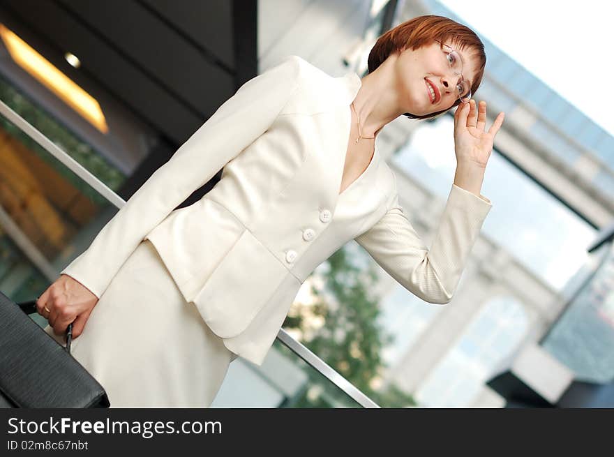 Business woman with black briefcase walking street