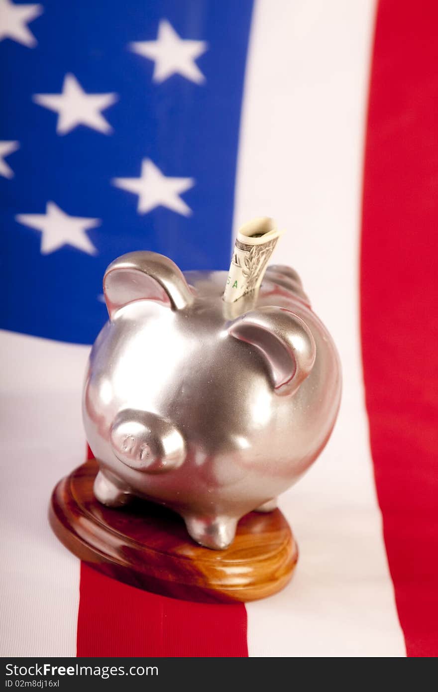 Piggy and money on american flag