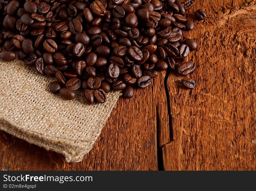 Roasted coffee beans on wood