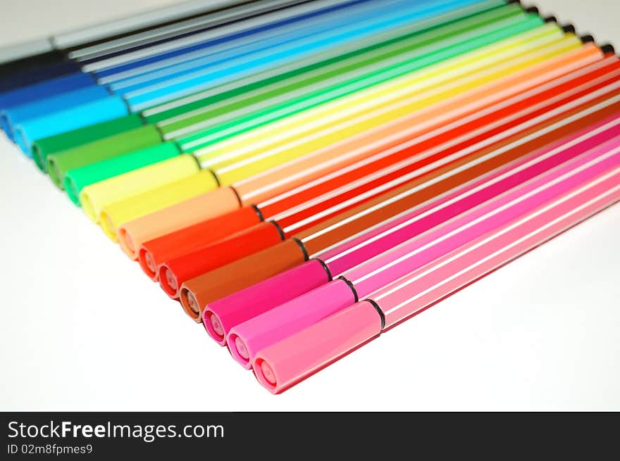 Row of many-colored felt-tip pens