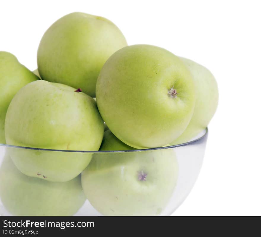 Isolated green apples in a glass bowl