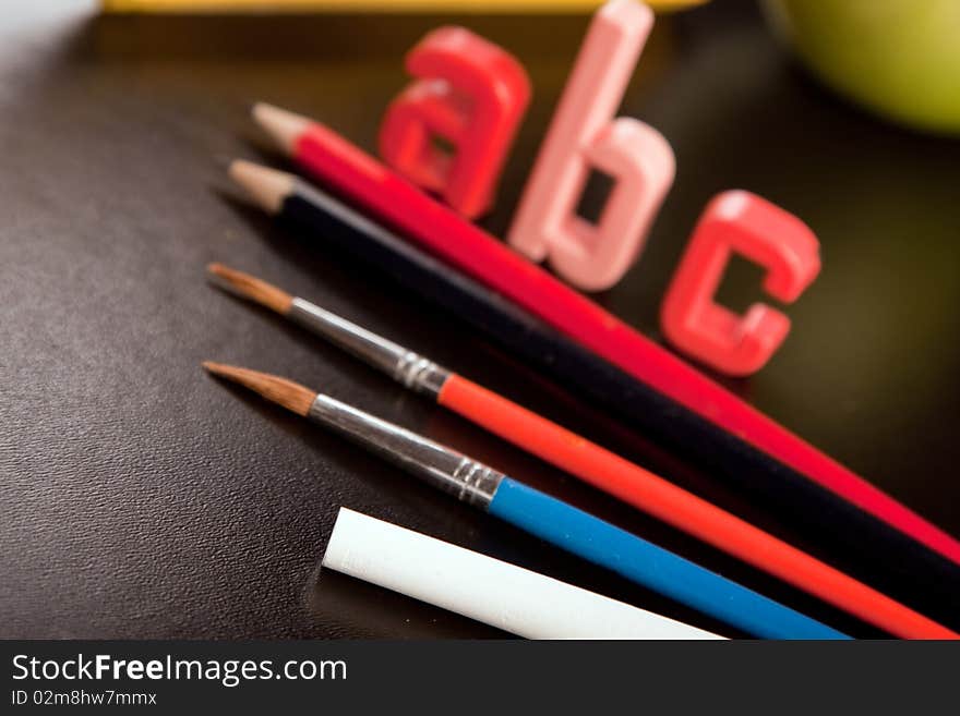 Blackboard and school equipment arranged in studio. Blackboard and school equipment arranged in studio