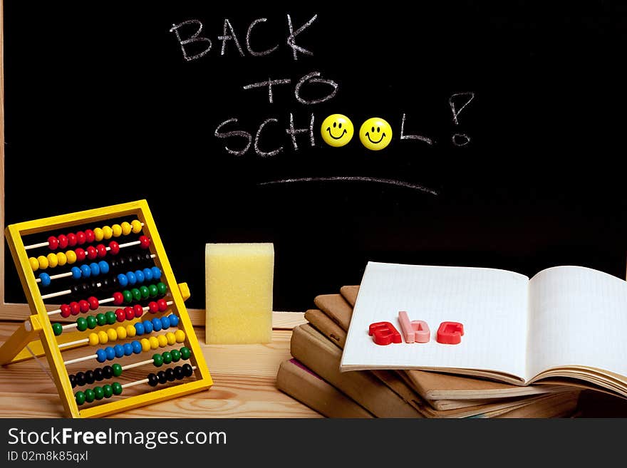 Education concept, black board, chalk and notebooks. Back to school!