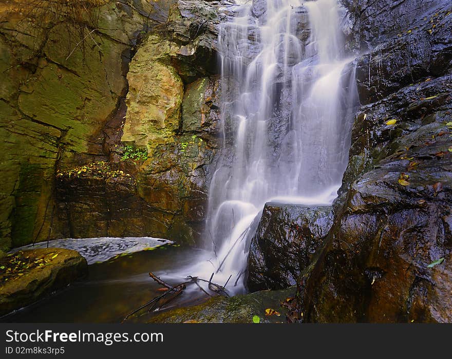 A waterfall falling calmly over rocks