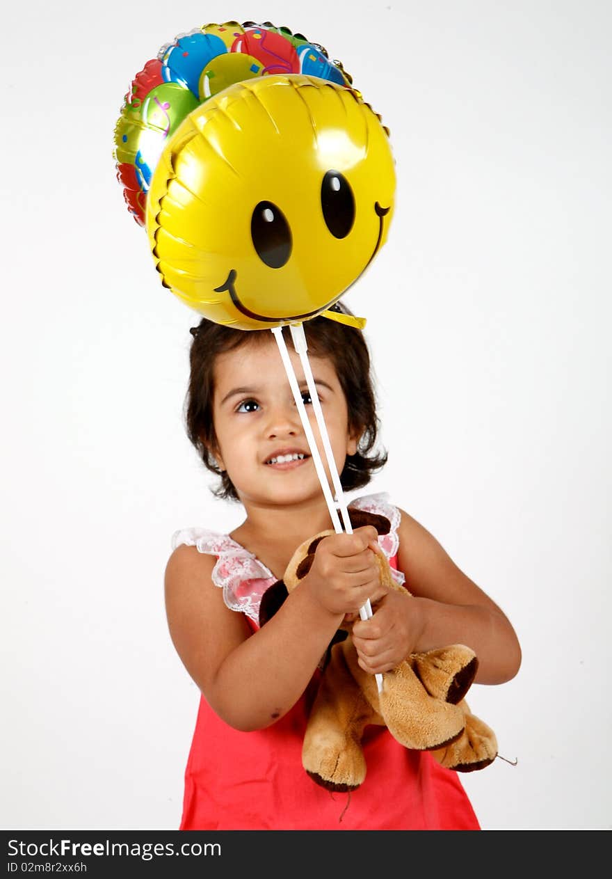 Sweet and cute toddler playing with ballons. Sweet and cute toddler playing with ballons