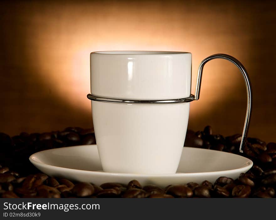 Coffee cup splash and coffee beans. Coffee cup splash and coffee beans