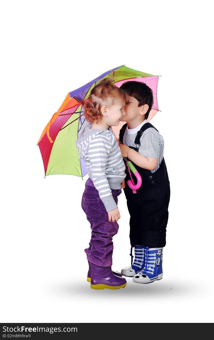 Little boy and little girl together under the umbrella of color. On a white background.