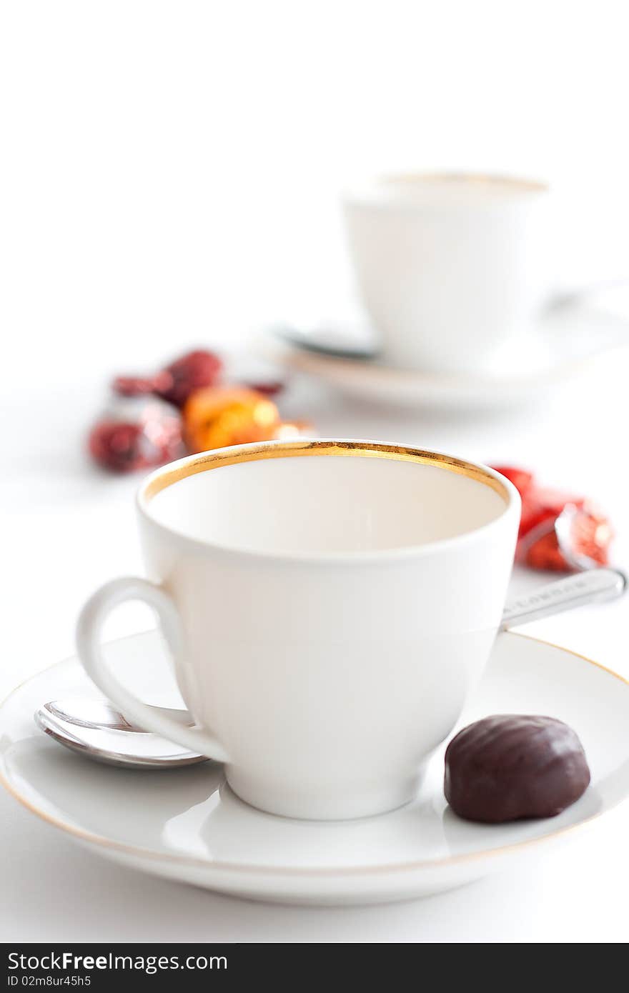 Empty coffee cups and chocolate in sunny morning at 10Mps