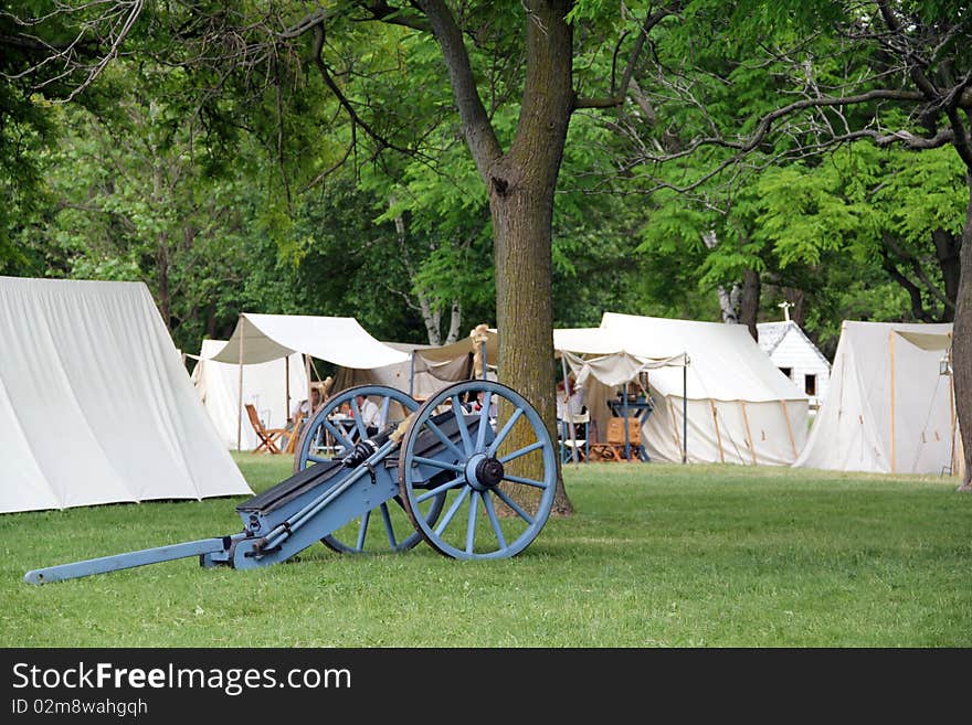 Canon stand in front of tents