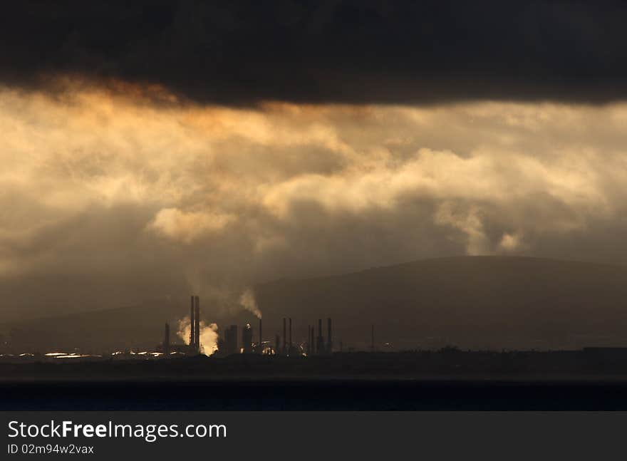 A oil refinery under clouds. A oil refinery under clouds.