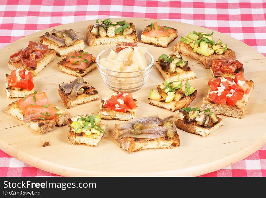 Various italian bruschetta over cutting board