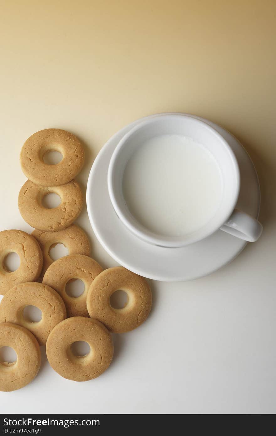 Still life with biscuits and a cup of milk. Still life with biscuits and a cup of milk