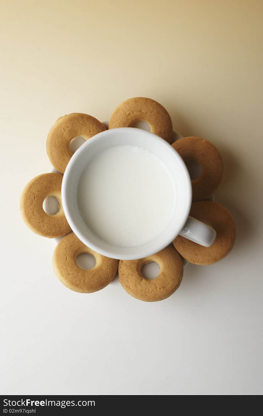 Still life with biscuits and a cup of milk. Still life with biscuits and a cup of milk