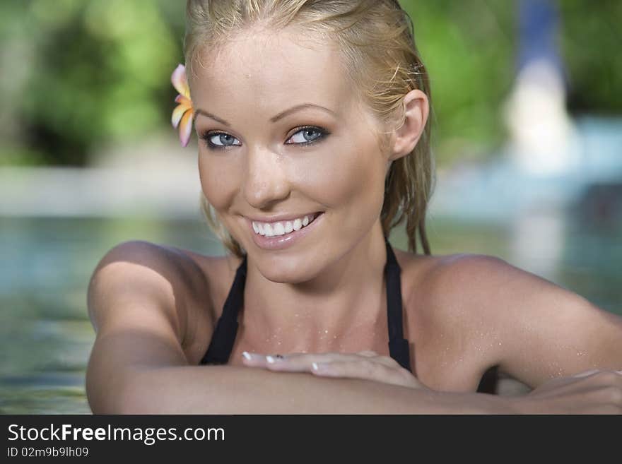 Portrait of young attractive woman having good time swimming pool. Portrait of young attractive woman having good time swimming pool