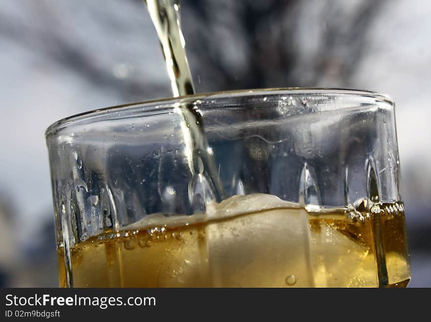 Fresh, cold iced tea being poured into a glass