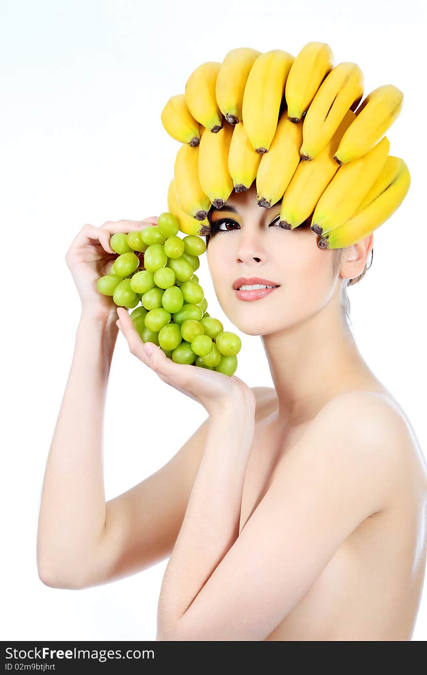 Shot of a beautiful young woman with fruits headwear. Food concept, healthcare. Shot of a beautiful young woman with fruits headwear. Food concept, healthcare.