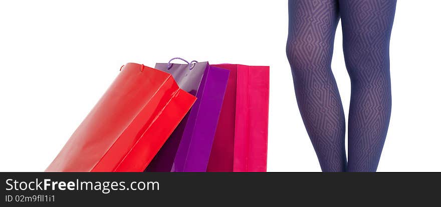 Shopping bags and woman legs wear panties isolated