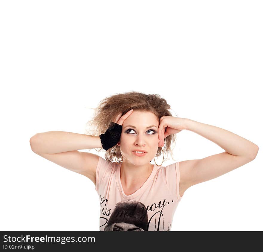 Young fashion model with her hands at her head. Isolated over white.