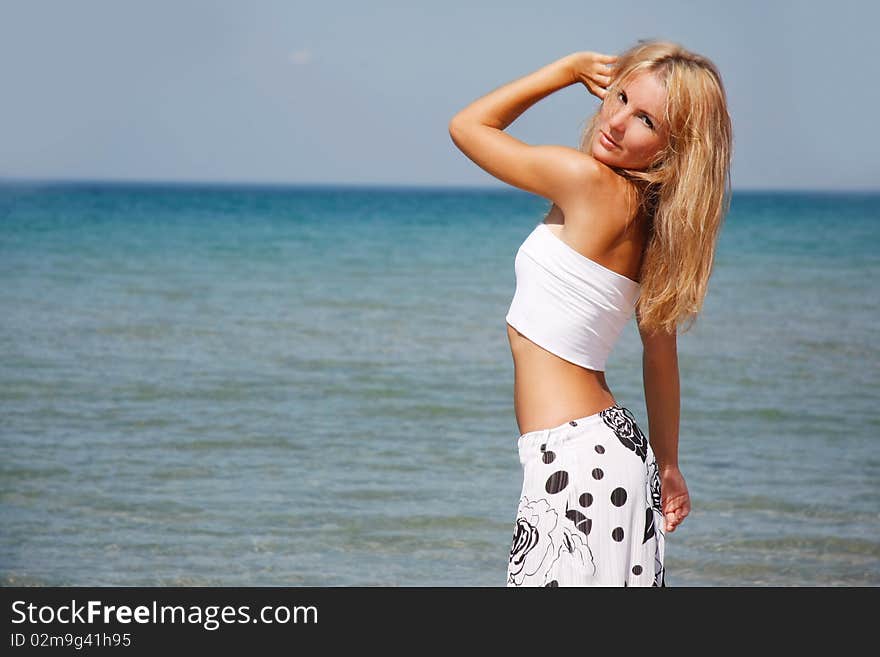 Beautiful woman on sea background