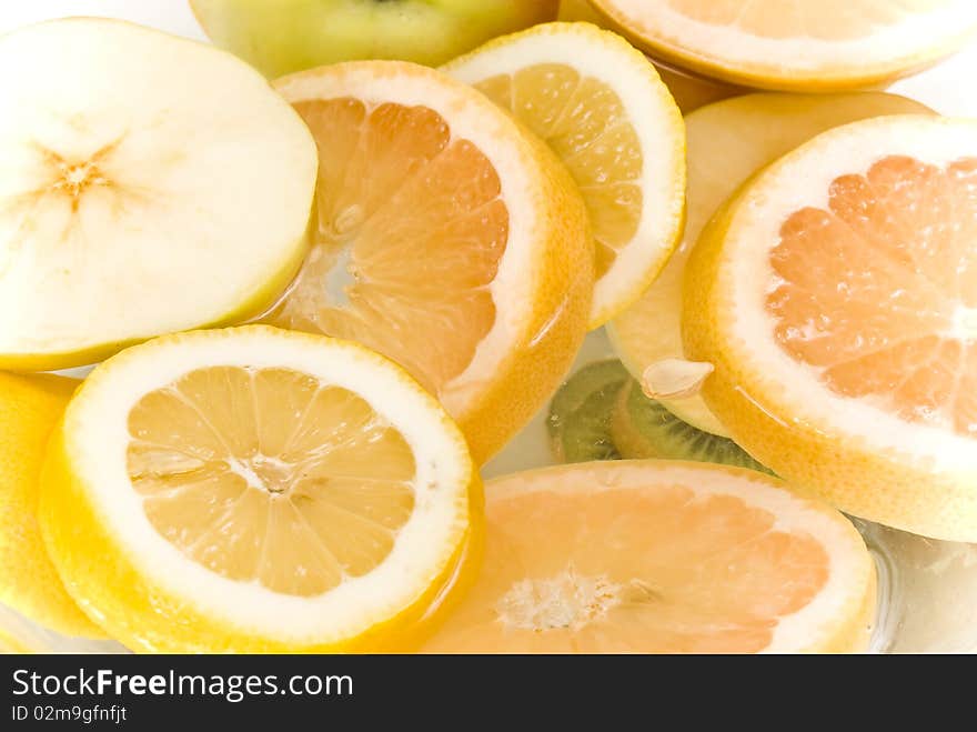 Fresh fruit slices on water. Fresh fruit slices on water