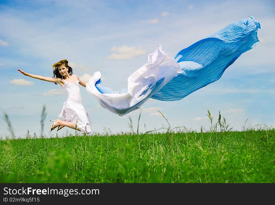 Happy young woman jumps