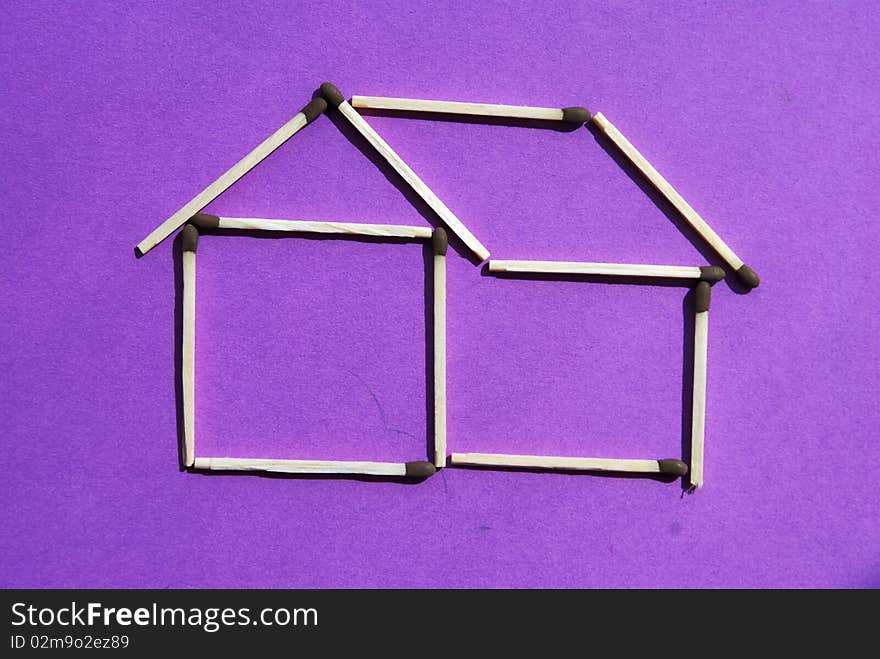 The idea of an house created with some matches. The idea of an house created with some matches