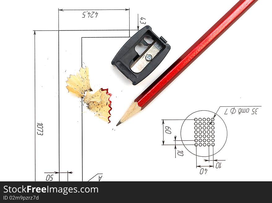 Sharpener, red pencill and blueprints. Sharpener, red pencill and blueprints