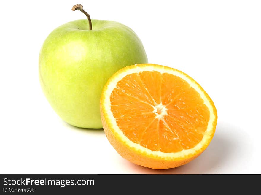 Green apple and half of orange. W. clipping path