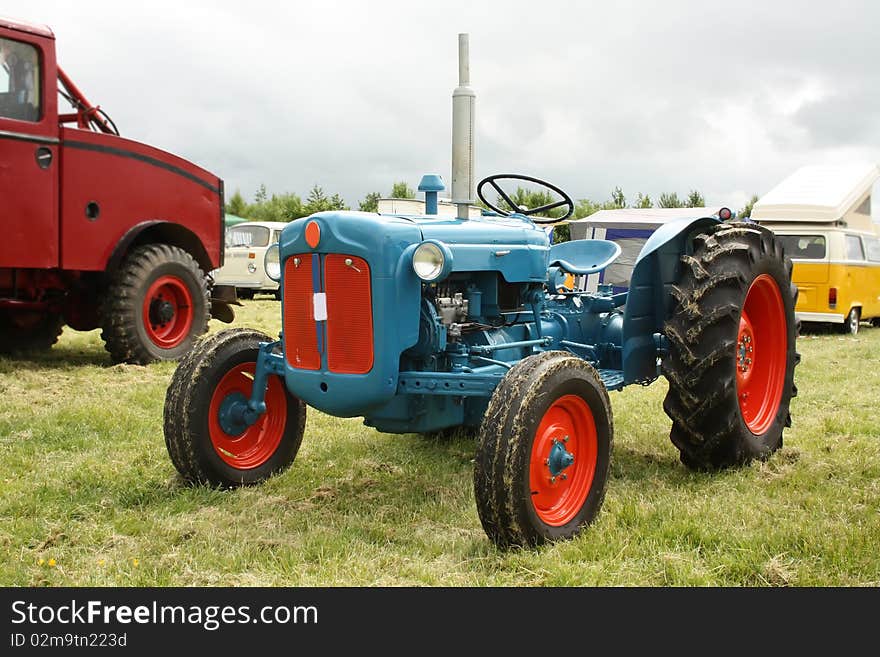 Old coloroul tractor on the grass. Old coloroul tractor on the grass