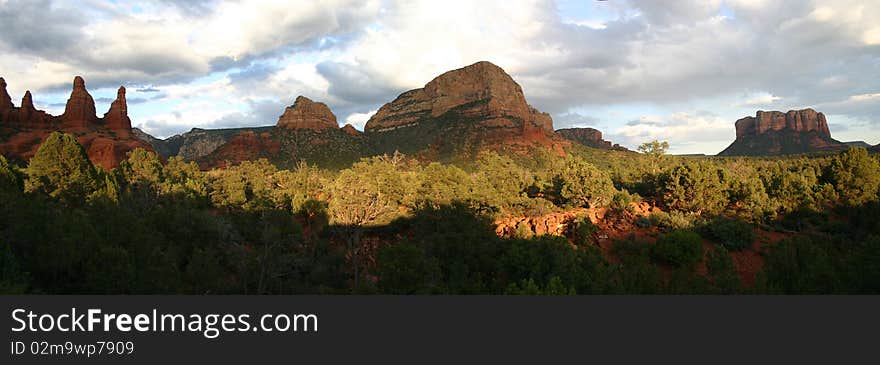 Panorama of Sedona Red Rocks Showing the Two Sisters, Gibraltar and Courthouse Rock in the late afternoon. Panorama of Sedona Red Rocks Showing the Two Sisters, Gibraltar and Courthouse Rock in the late afternoon