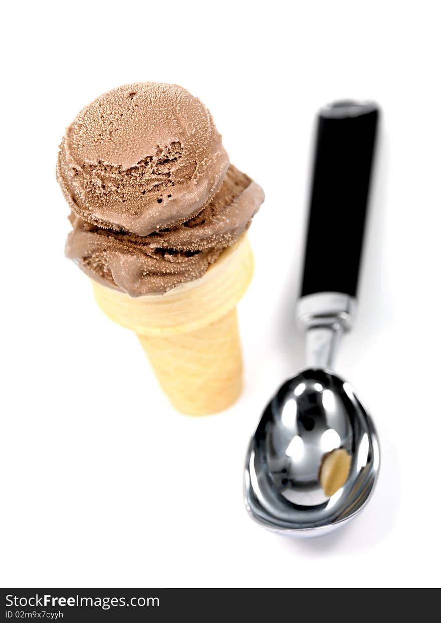 Chocolate icecream in an icecream cone isolated against a white background