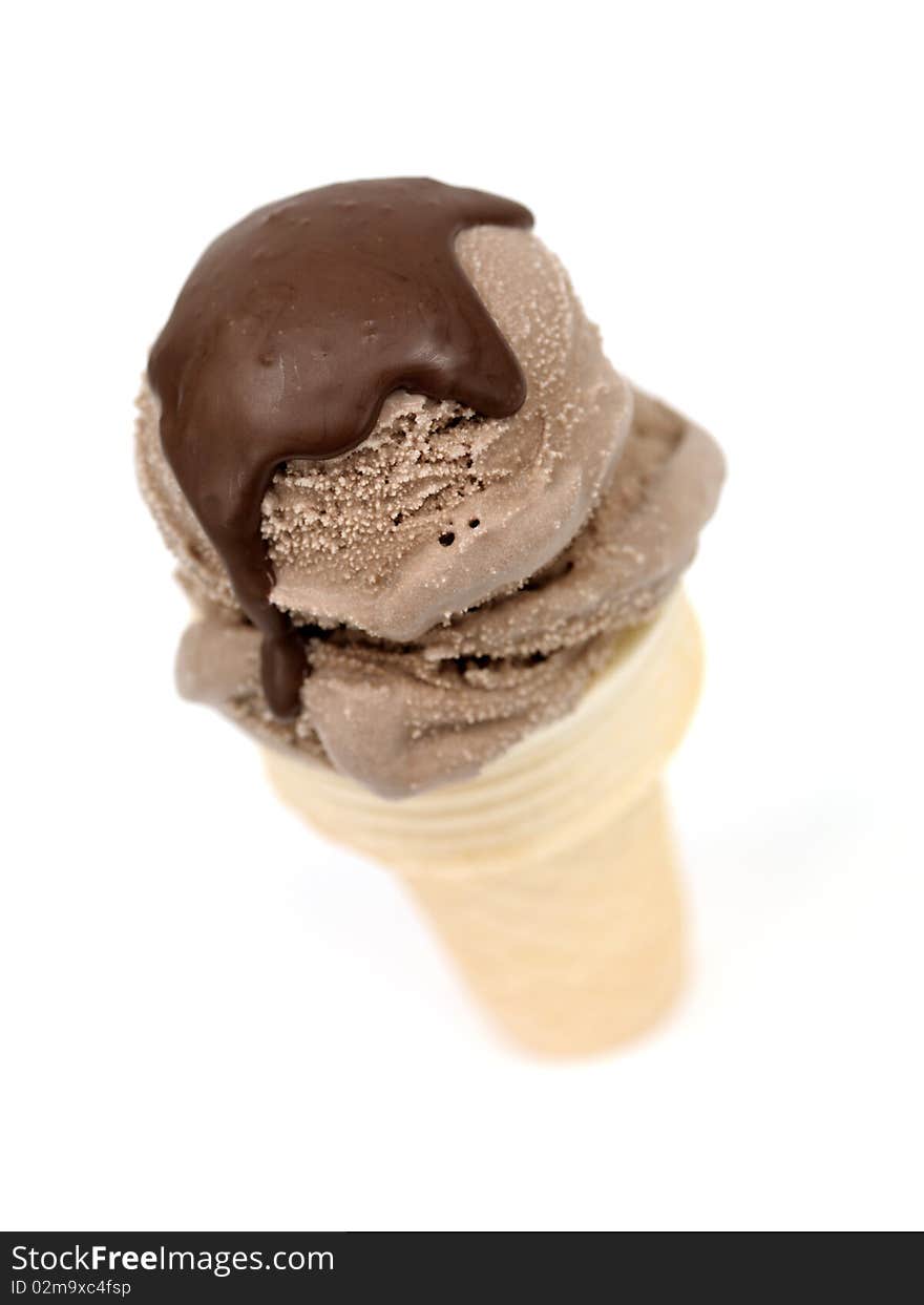 Chocolate icecream in an icecream cone isolated against a white background