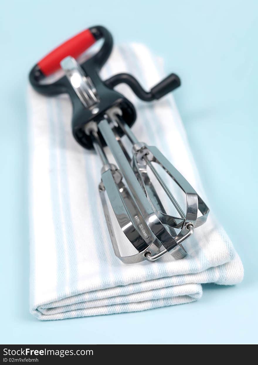 An egg beater on a kitchen bench