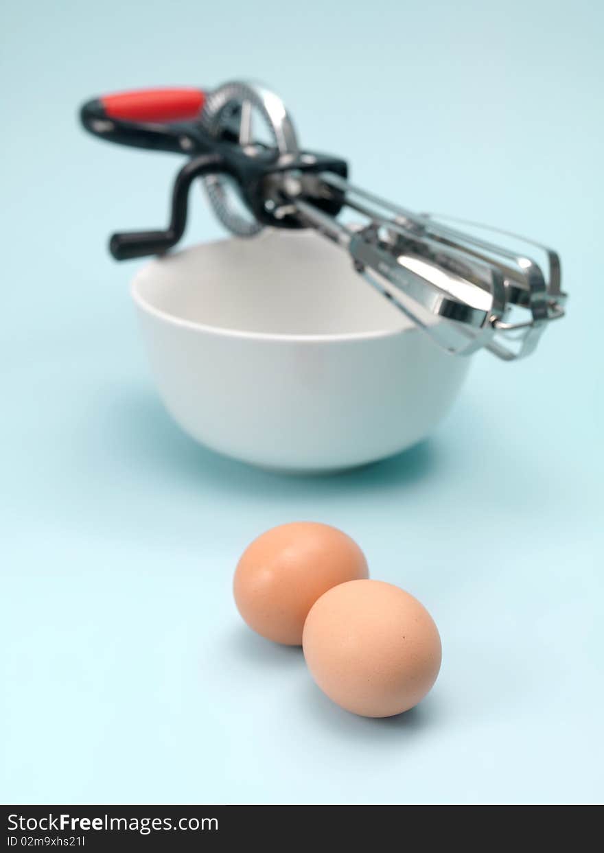 An egg beater on a kitchen bench