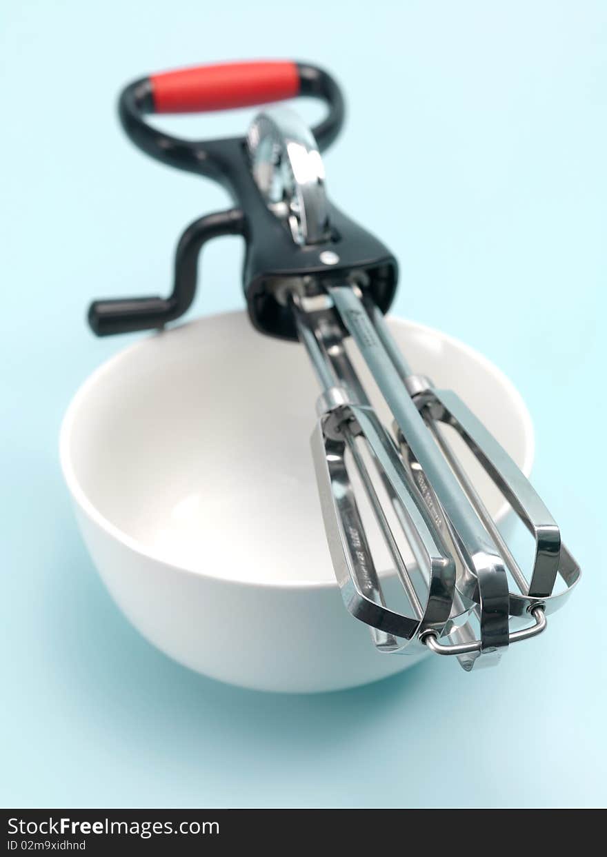 An egg beater on a kitchen bench