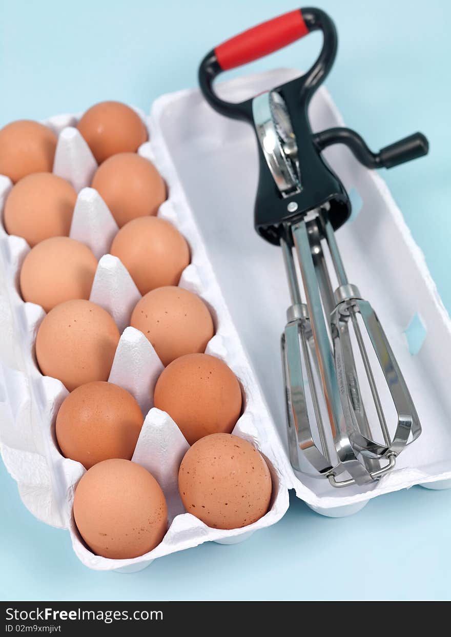 An egg beater on a kitchen bench