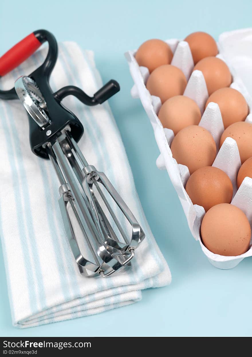 An egg beater on a kitchen bench