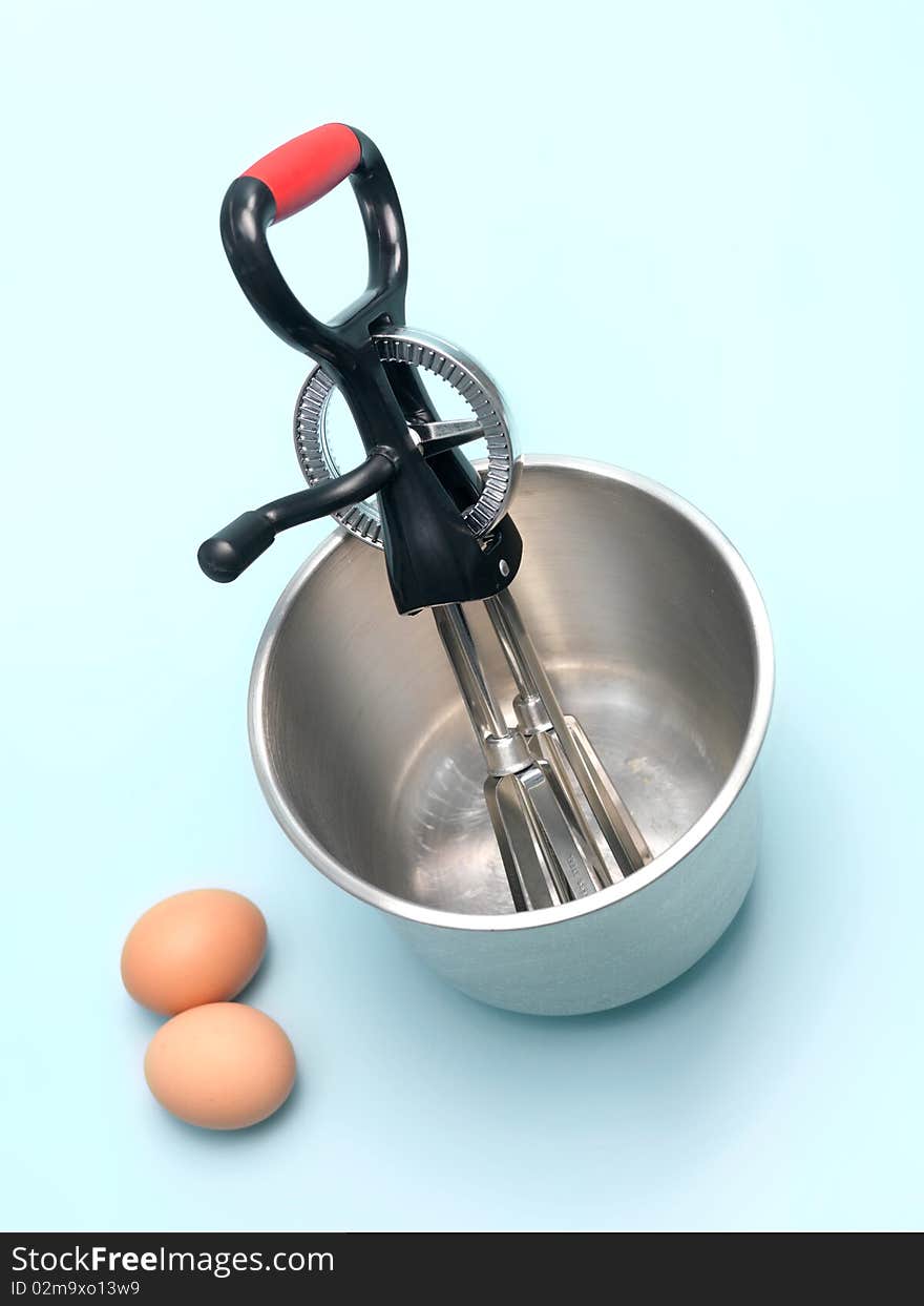 An egg beater on a kitchen bench