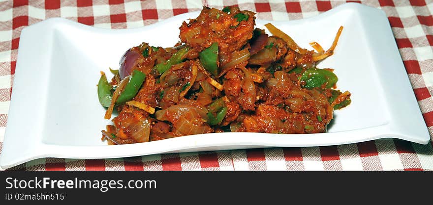 Chilly chicken in white bowl