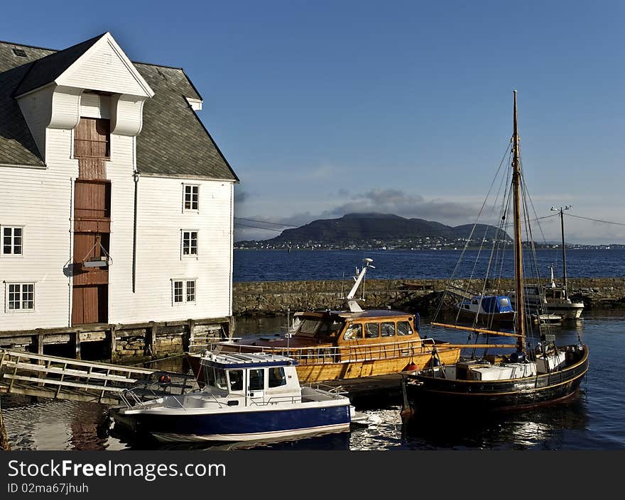 Alesund - one of the nicest cities of the northern Norway. Here there are severeal beautiful old and modern wharfs for both small fishing vessels and huge cruise ships. Alesund - one of the nicest cities of the northern Norway. Here there are severeal beautiful old and modern wharfs for both small fishing vessels and huge cruise ships