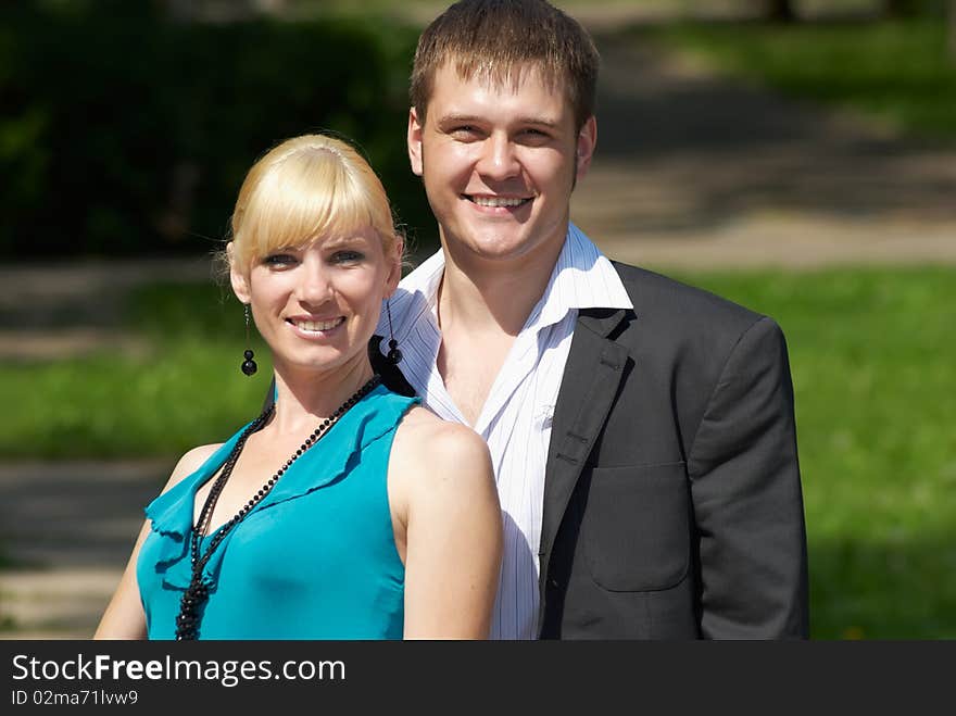 Portrait of a happy young couple in park