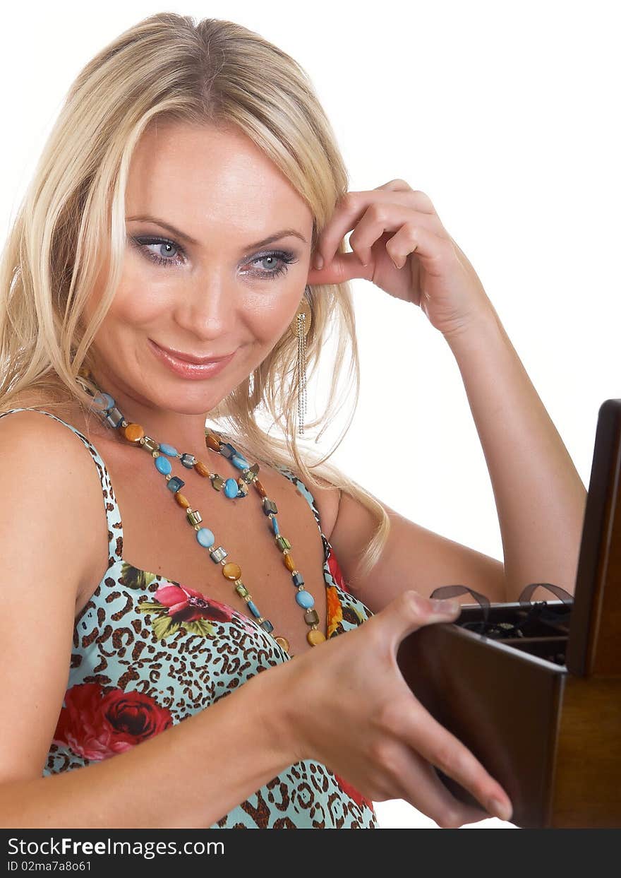 The girl with jewelry casket on white background