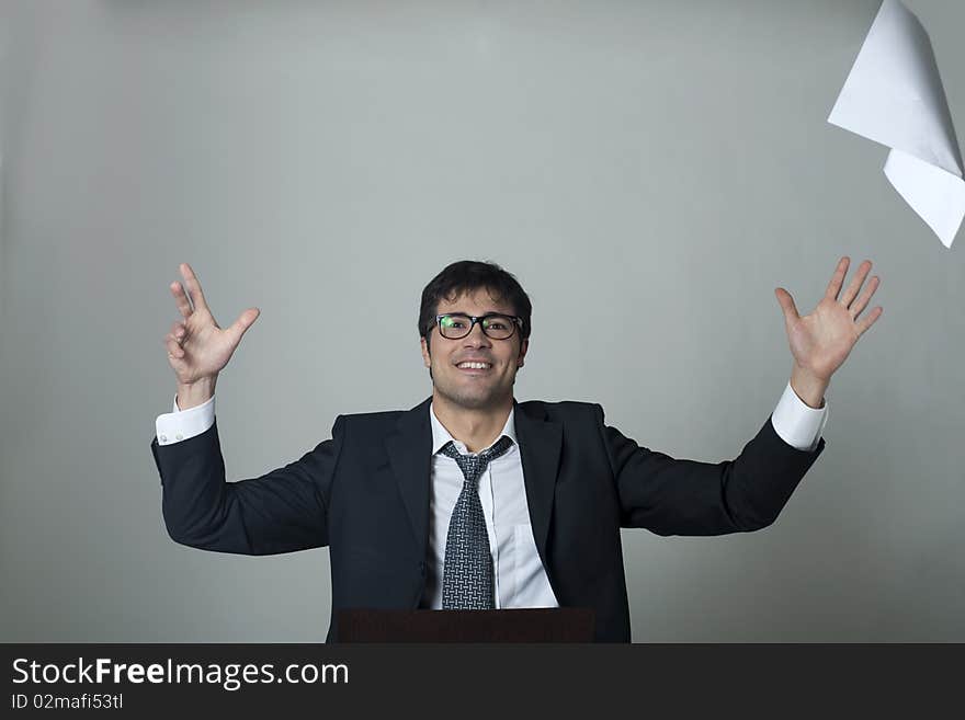 Businessman throwing documents away! Isolated on grey