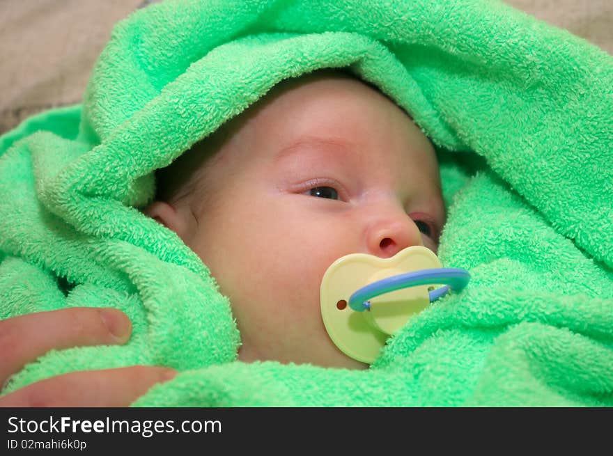 Photo of the beautiful baby lying on bed