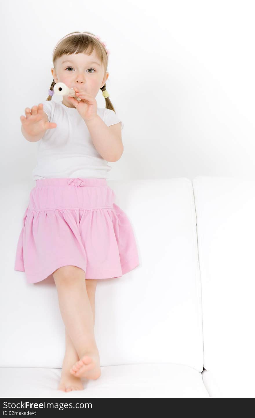 Sweet happy little girl with instrument